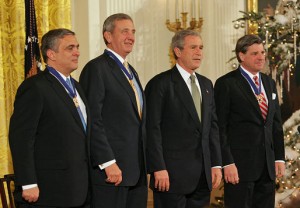 1130 President Bush, Laura Bush: Ceremony for Recipients of the Presidential Medal of Freedom: George J. Tenet, General Tommy R. Franks and L. Paul Bremer III (left to right on-stage). East Room. State Floor.